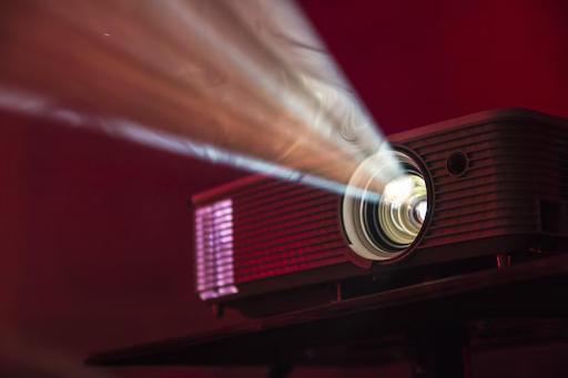 A projector emitting a mysterious aura of smoke, creating an intriguing atmosphere.