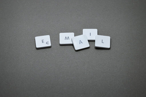 Four keyboard buttons featuring the letters "E", "M", "A", and "I", with the "E" button additionally displaying the Euro symbol. The alt text describes four specific buttons on a keyboard. The first button is labeled "E" and also features the Euro symbol (€). The second button is labeled "M", the third button is labeled "A", and the fourth button is labeled "I". The alt text does not provide additional details about the keyboard's layout, color, or other buttons. The emphasis is on the "E" button displaying both the letter and the Euro symbol, potentially indicating its relevance in email or financial contexts.
